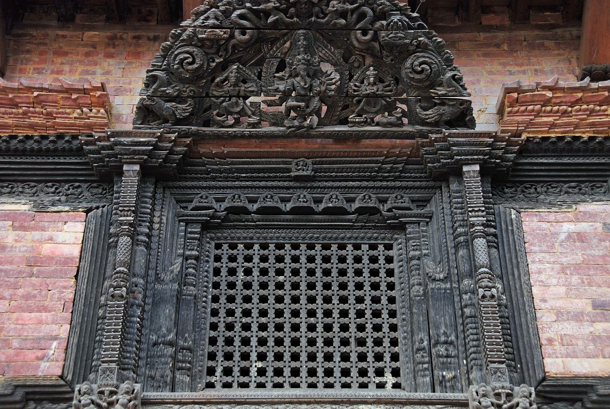 Kathmandu Bhaktapur 03-2 Bhaktapur Durbar Square Palace Of 55 Windows Close Up Here is a close up of one of the 55 beautifully carved windows in the Palace of 55 Windows in Bhaktapurs Durbar Square.